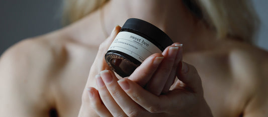 Sweet Bee Organics jar held in hands showing expert nutritionist picks for cortisol and hormone balance