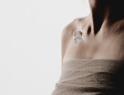 Breathe Deep balm applied to the chest and collarbone